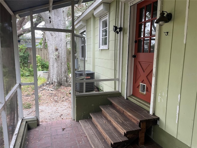 entrance to property with central AC and fence