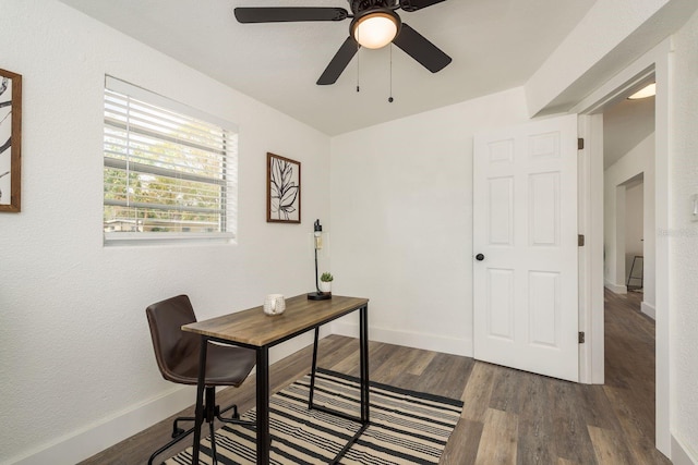 office area with a ceiling fan, baseboards, and wood finished floors