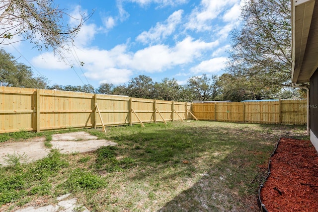 view of yard featuring a fenced backyard