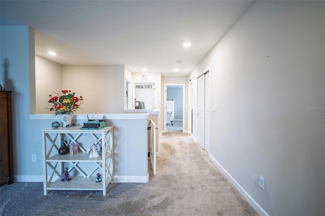 corridor with recessed lighting, carpet flooring, and baseboards