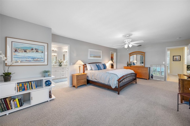 bedroom featuring a ceiling fan, carpet flooring, and ensuite bathroom