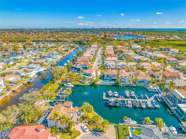 birds eye view of property featuring a water view and a residential view