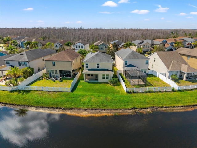 bird's eye view with a residential view and a water view