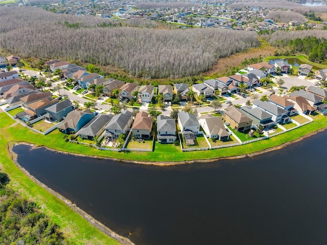 bird's eye view featuring a water view and a residential view