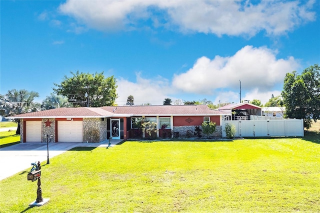 single story home featuring concrete driveway, stone siding, an attached garage, fence, and a front lawn