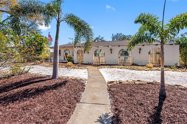 view of front of property featuring french doors and stucco siding