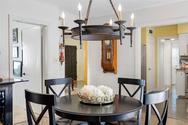 dining room featuring visible vents