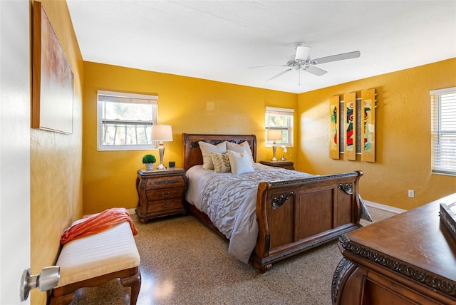 bedroom featuring a textured wall and ceiling fan