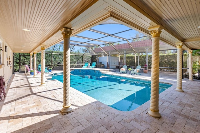 pool featuring a lanai and a patio