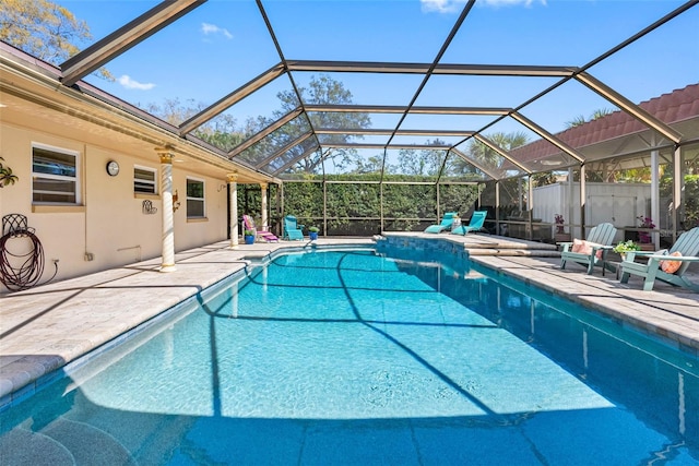 outdoor pool featuring a patio and a lanai