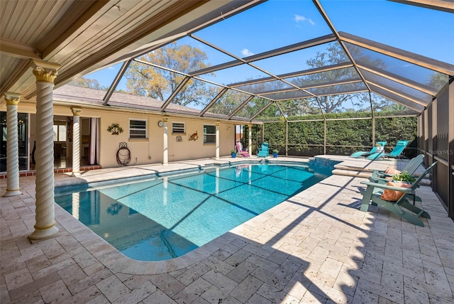 pool with a lanai and a patio