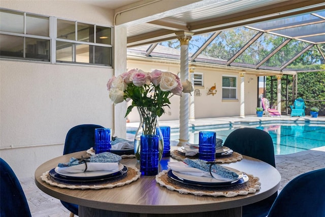 dining space with a sunroom and plenty of natural light