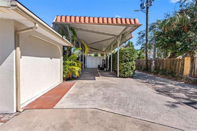 view of car parking featuring fence