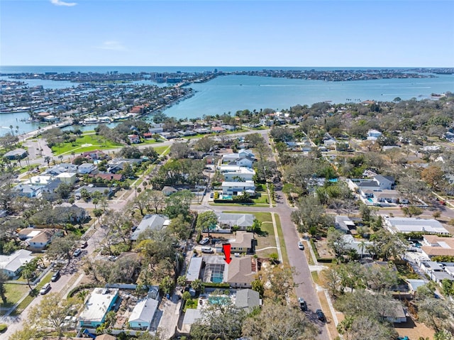 birds eye view of property with a water view and a residential view