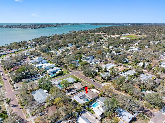 drone / aerial view featuring a residential view and a water view