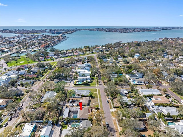 drone / aerial view with a water view and a residential view