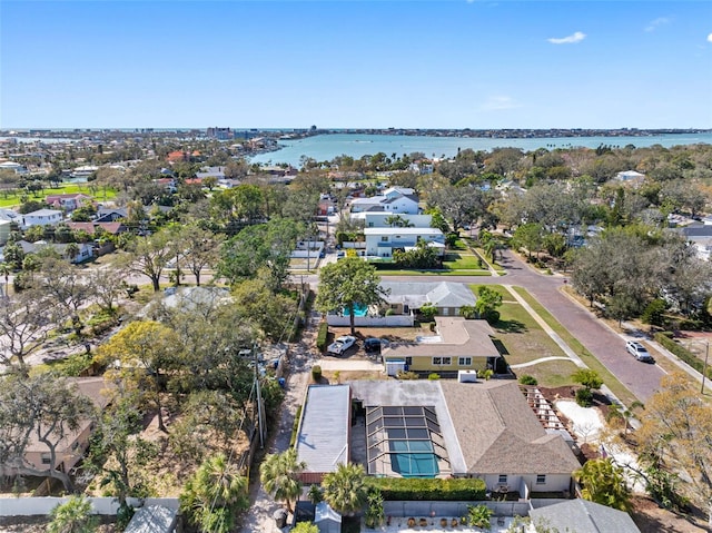 drone / aerial view featuring a water view and a residential view