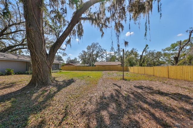 view of yard with fence