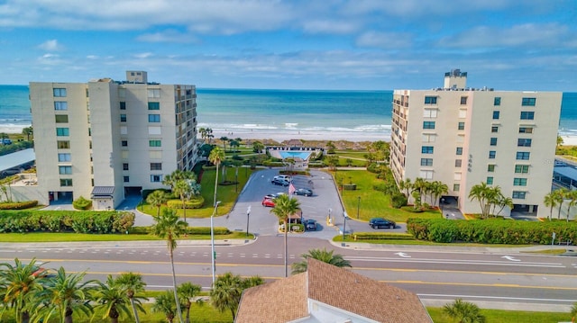 aerial view featuring a water view and a beach view