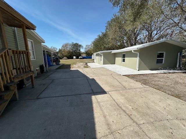 exterior space featuring driveway and stucco siding