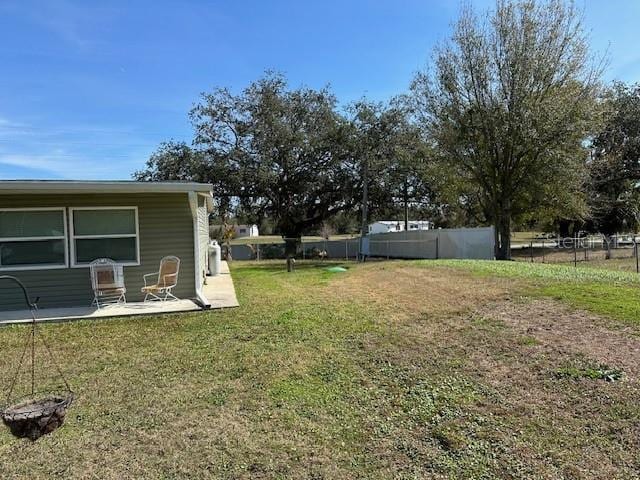 view of yard with a patio and fence