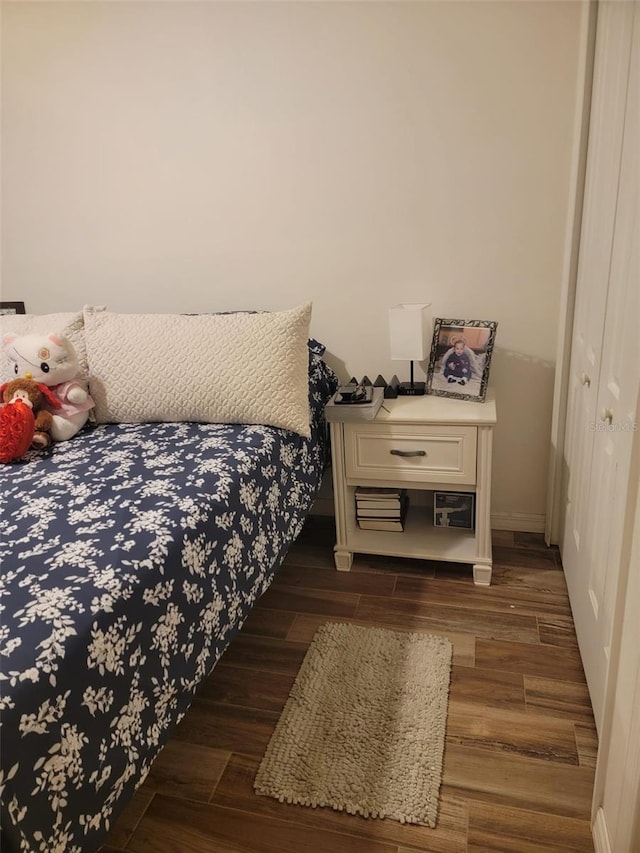 bedroom featuring wood finished floors