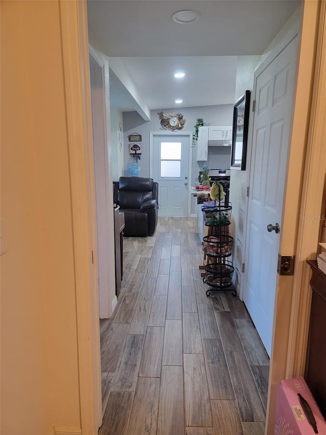 hallway with wood finish floors