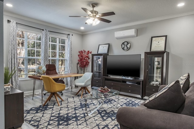 office space featuring light wood finished floors, ceiling fan, ornamental molding, and an AC wall unit