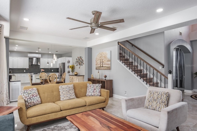 living area featuring stairway, recessed lighting, and baseboards