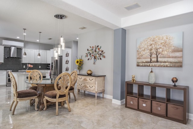 dining room with marble finish floor, visible vents, and baseboards