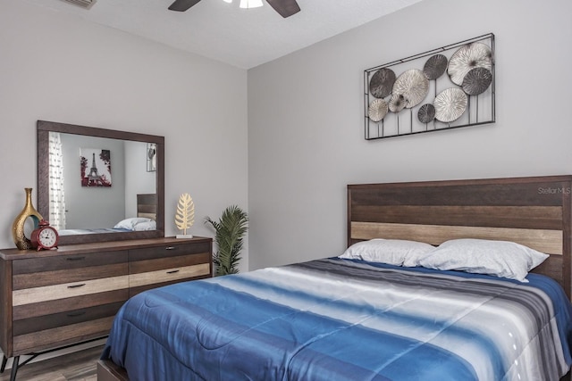 bedroom with wood finished floors and a ceiling fan