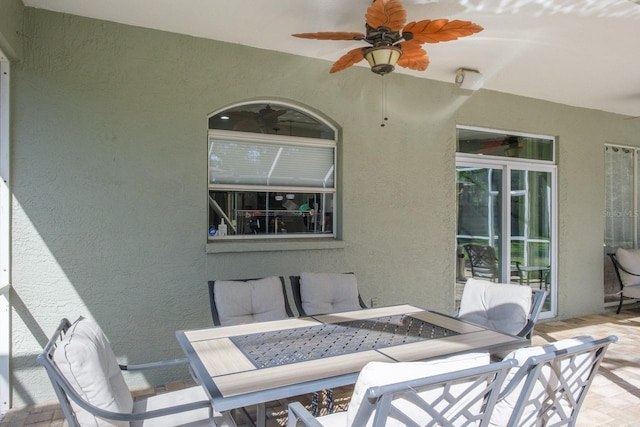 view of patio featuring a ceiling fan and outdoor dining space