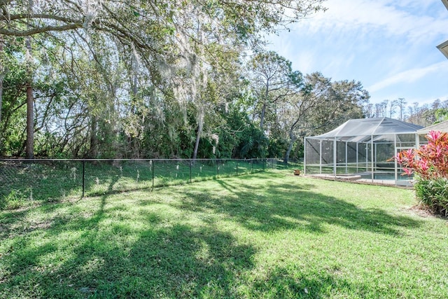 view of yard featuring a fenced backyard, a lanai, and a fenced in pool