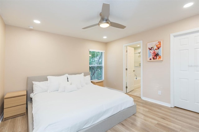 bedroom with recessed lighting, ceiling fan, ensuite bath, light wood-type flooring, and baseboards