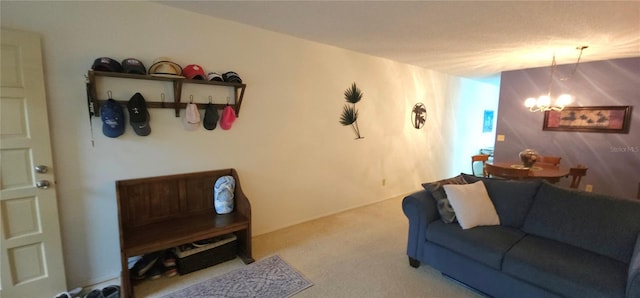 living area with carpet flooring and an inviting chandelier