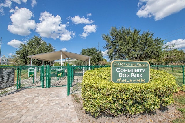 view of home's community with fence and a gate