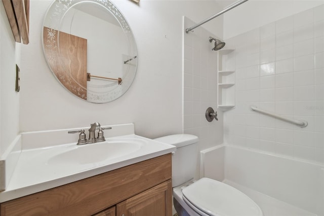 bathroom featuring toilet, walk in shower, and vanity