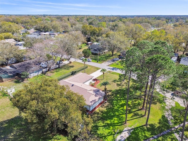 drone / aerial view featuring a view of trees