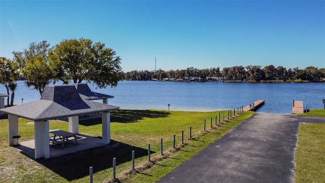 property view of water featuring a dock and a gazebo