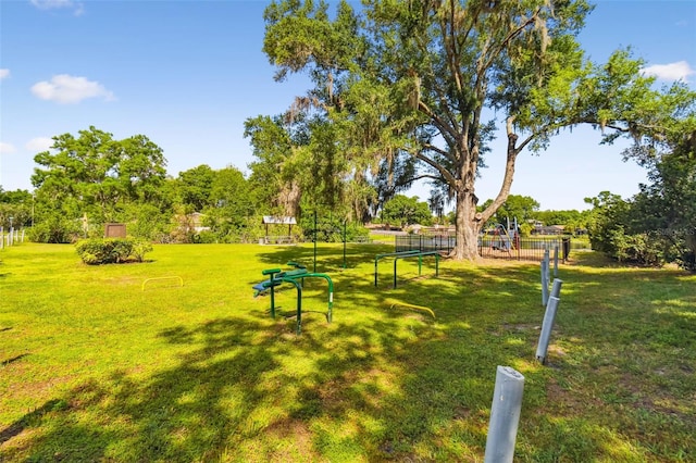 view of home's community with a yard