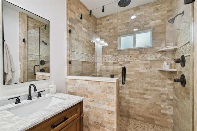 full bathroom featuring a shower stall and vanity