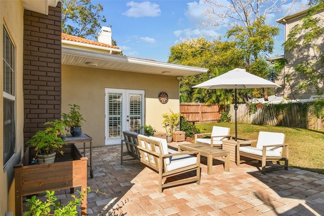 view of patio / terrace with a fenced backyard, outdoor lounge area, and french doors