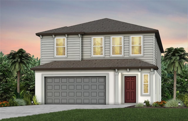 view of front of property featuring concrete driveway, a shingled roof, and an attached garage