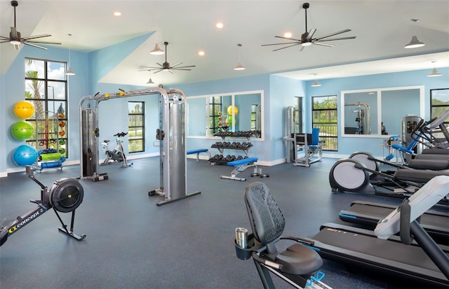 exercise room with a ceiling fan, plenty of natural light, and baseboards