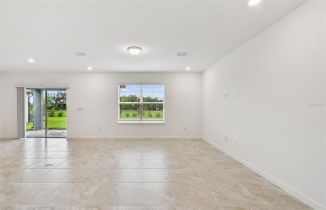 10410 Cross River Trl, Parrish, FL 34219 - spare room featuring healthy amount of natural light, recessed lighting, and light tile patterned floors