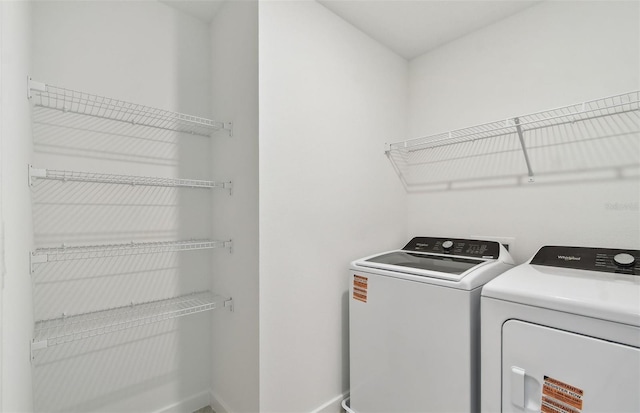 10410 Cross River Trl, Parrish, FL 34219 - laundry room featuring independent washer and dryer and baseboards