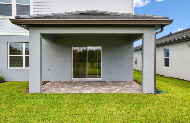 10410 Cross River Trl, Parrish, FL 34219 - rear view of property with a patio, a yard, and a shingled roof