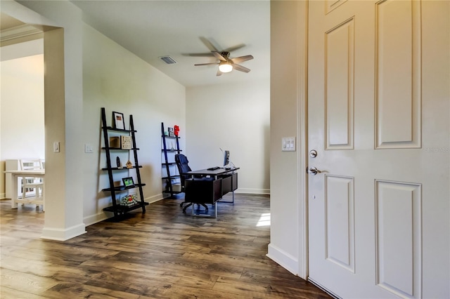 home office with dark wood-style flooring, visible vents, ceiling fan, and baseboards