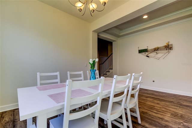 dining space featuring baseboards, ornamental molding, dark wood-type flooring, stairs, and a chandelier