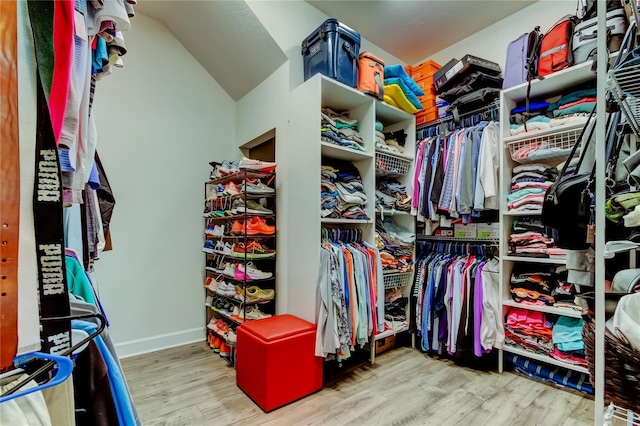 walk in closet with light wood-type flooring